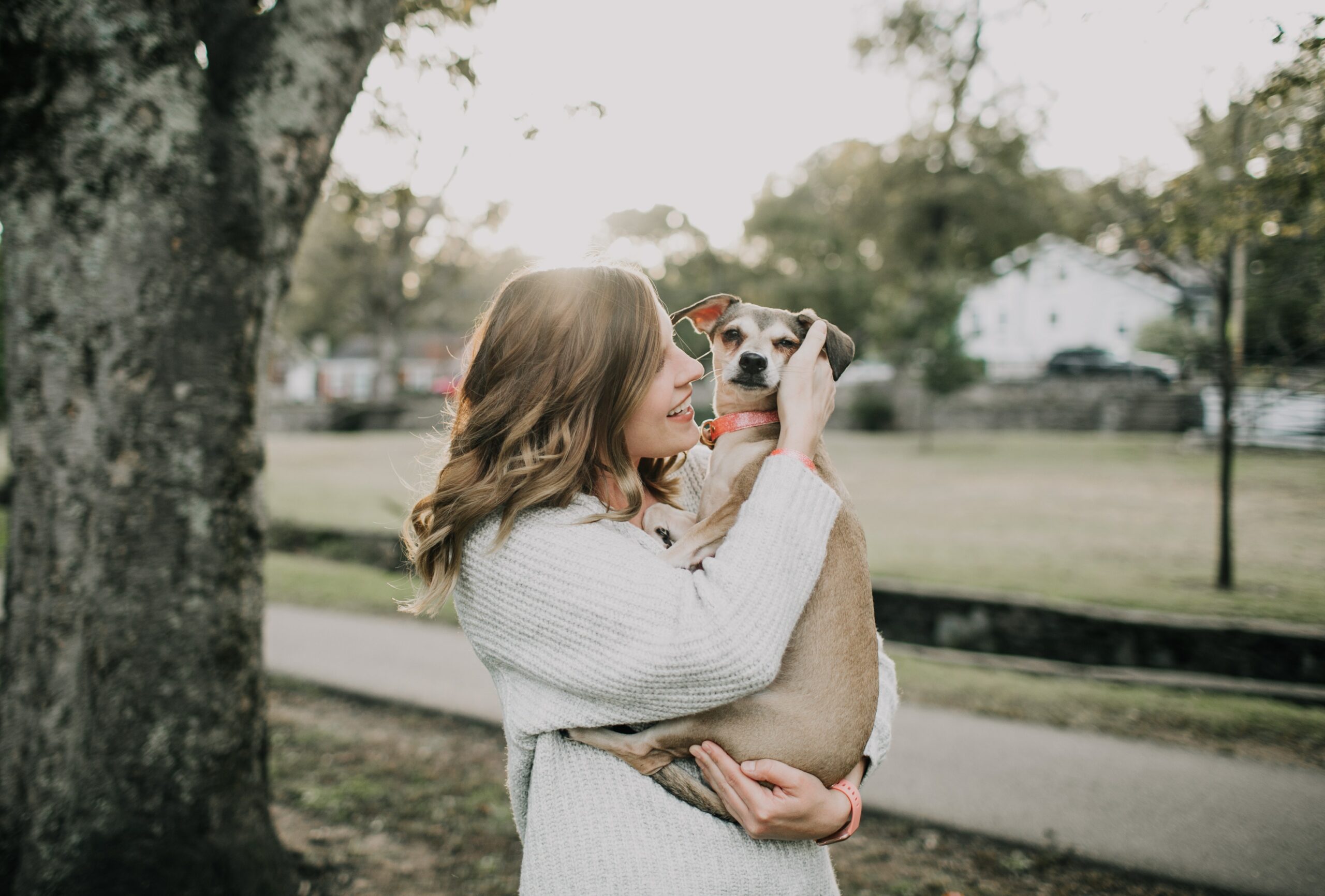 woman hugging dog